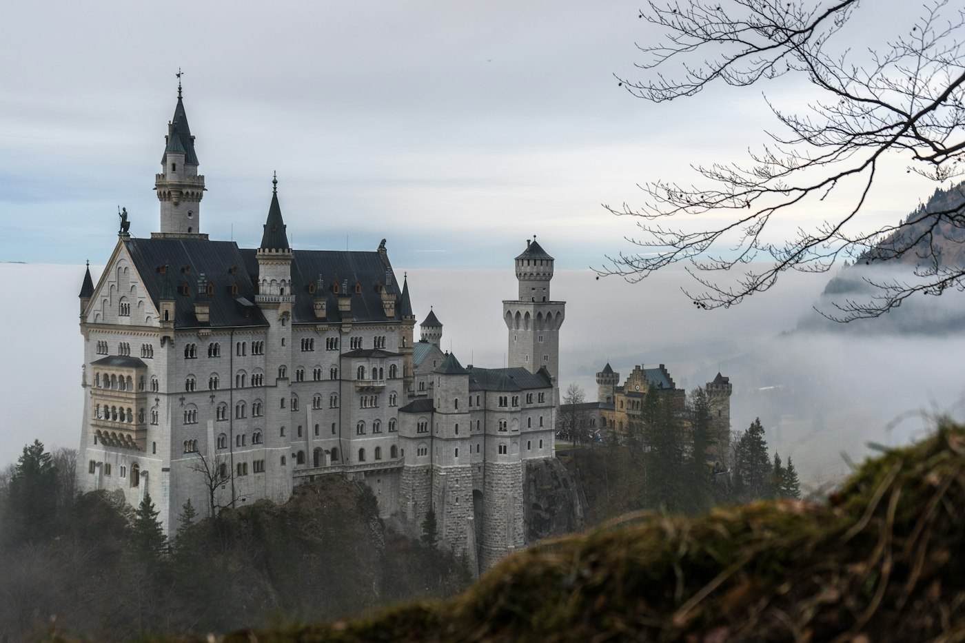 Neuschwanstein castle in Bavaria above a sea of fog